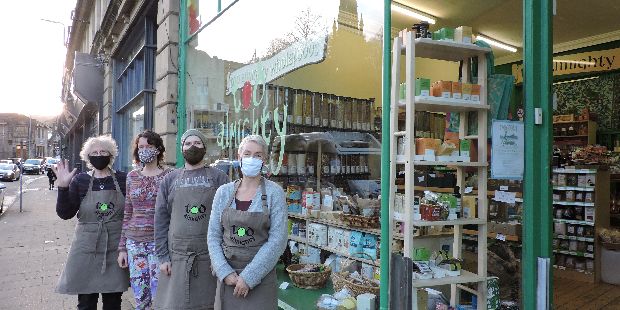 Clare, Graham, Krista and Sally (waving) outside the new shop.